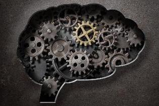 The silhouette of a human brain with cogs and gears filled in.