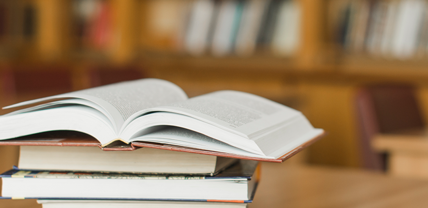 Stack of books on library desk